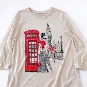 Chic Beige Top with Red Graphic